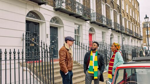 A couple on a Mini car tour, stopping outside Claremont Square