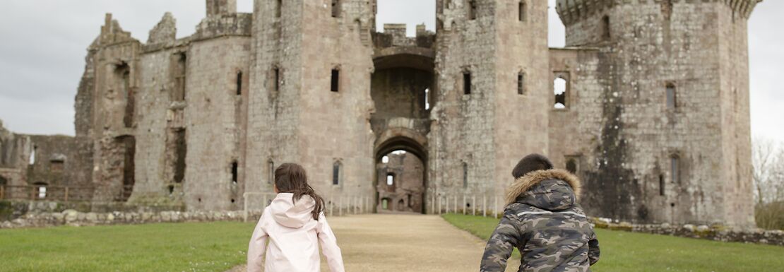 Cadw Explorer Pass - Children running in front of castle in Wales