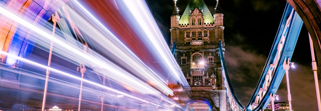 Zooming across Tower Bridge at night