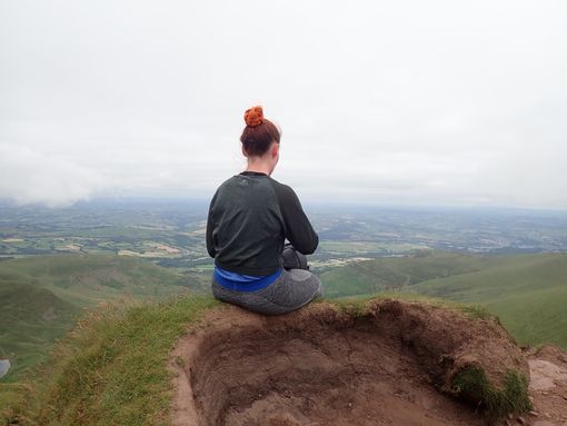 Hiker enjoying landscape views on their way up to Pen y Fan