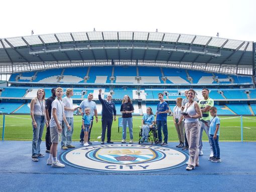 The Ethiad stadium visited by a group close to the pitch