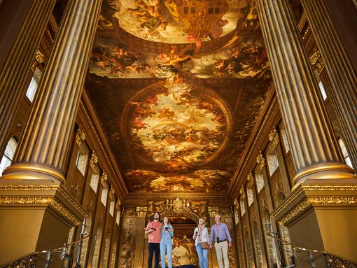 Painted Pall visited by tourists pictured between tall columns in a grand room