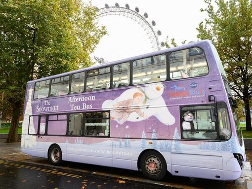 Snowman bus with London Eye in background