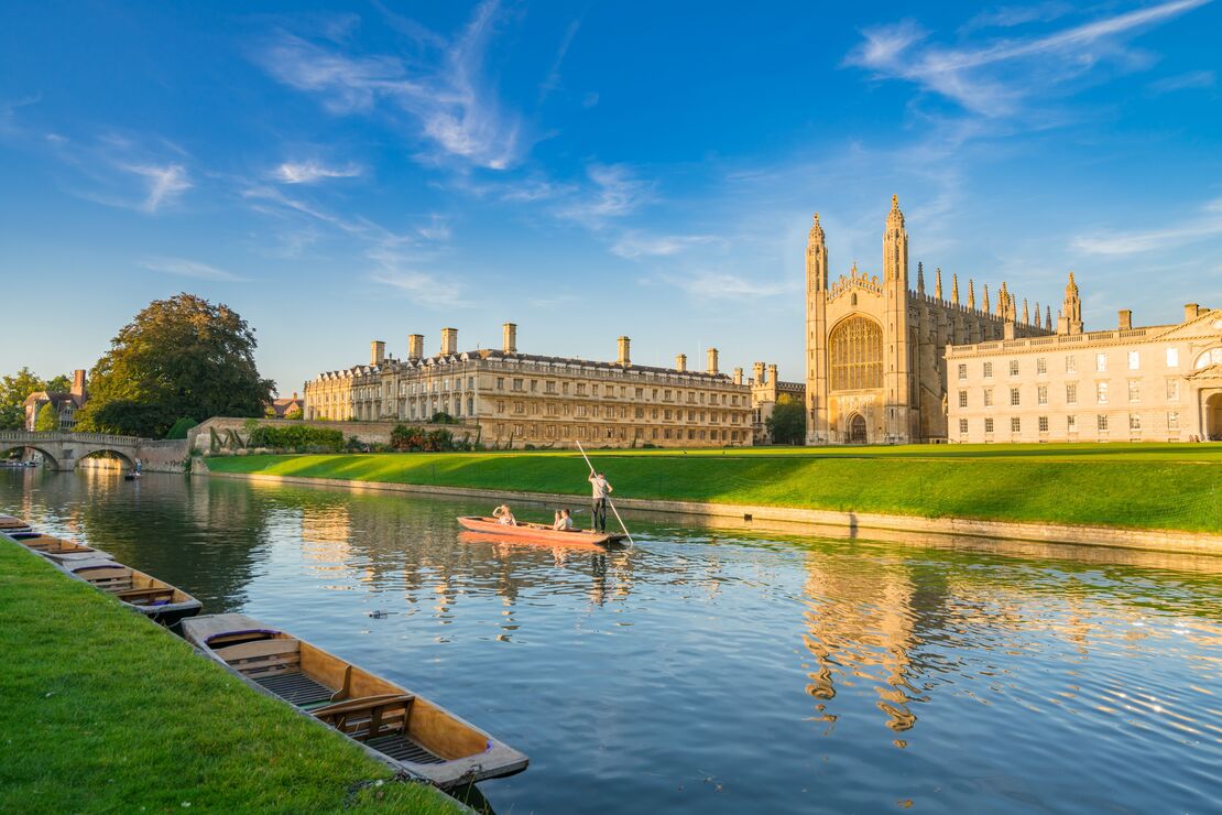 View of college in Cambridge with people punting on River