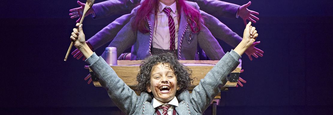 Matilda the Musical on stage where the children sing and dance in their school