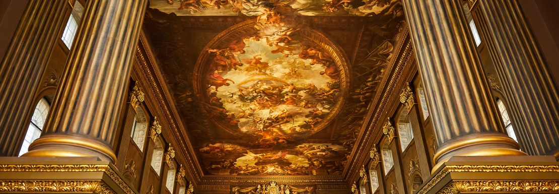 People standing under The Painted Hall in Greenwich admiring the outstanding artwork