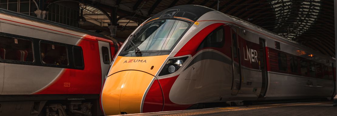 A LNER London North Eastern Railway train standing by the platform