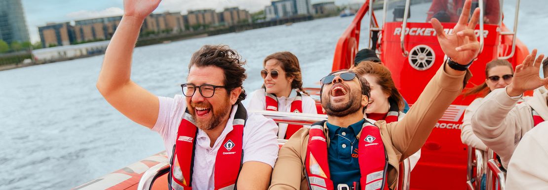 People put their hands up whilst a Thames Rockets speedboat accelerates