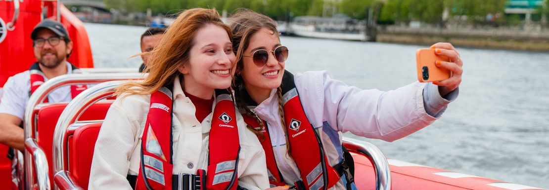 Friends take a selfie at high speed on their Thames Rockets speedboat ride