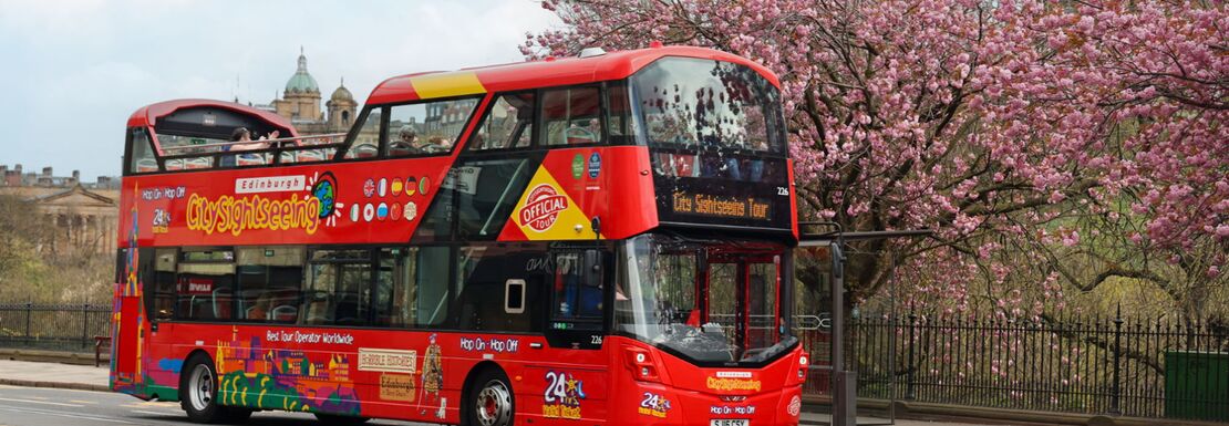 Classic red double decker bus in downtown Edinburgh