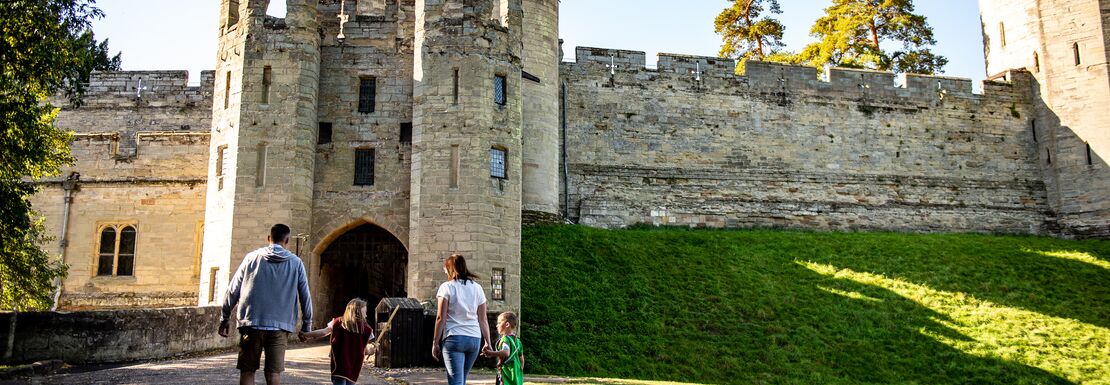 People walking up to Warwick Castle on a lovely sunny day
