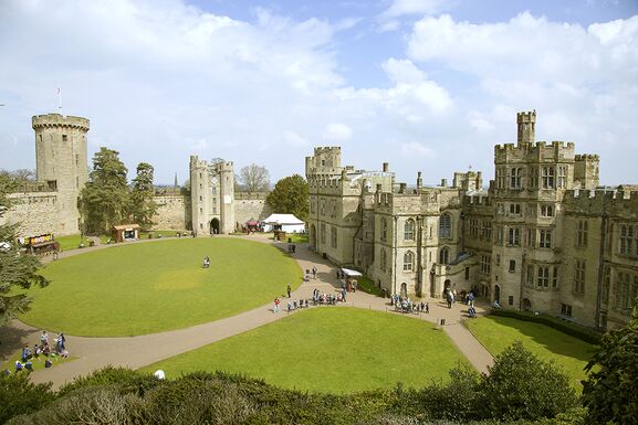 A view from the side shows the lovely green nature surrounding Warwick Castle