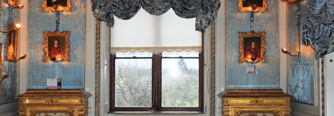 Warwick Castle blue boudoir shows an historical style with a view to the gardens