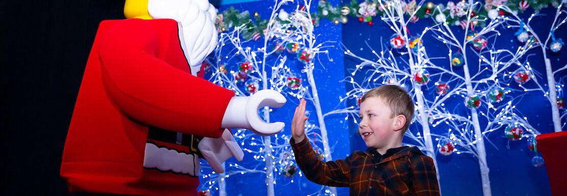 LEGO Santa meeting a guest at the LEGOLAND® Discovery Centre Birmingham