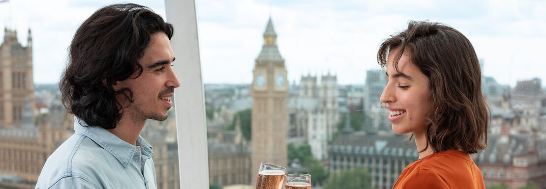 A man and a woman drinking champagne during daylight